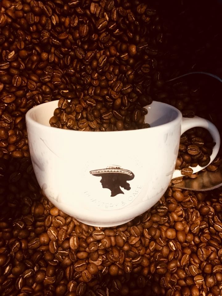 Francy's logo is displayed on a mug surrounded by coffee beans.